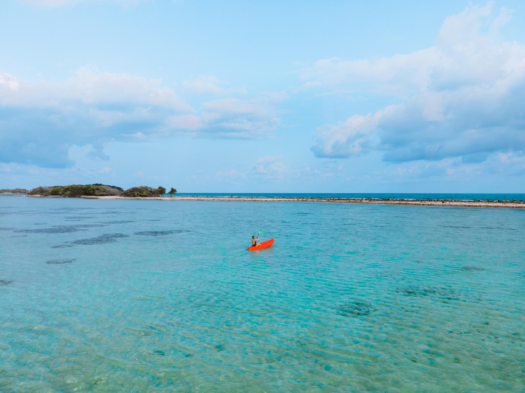 Chaweng Regent Beach Resort Exterior photo A kayaker on the waters of the lagoon